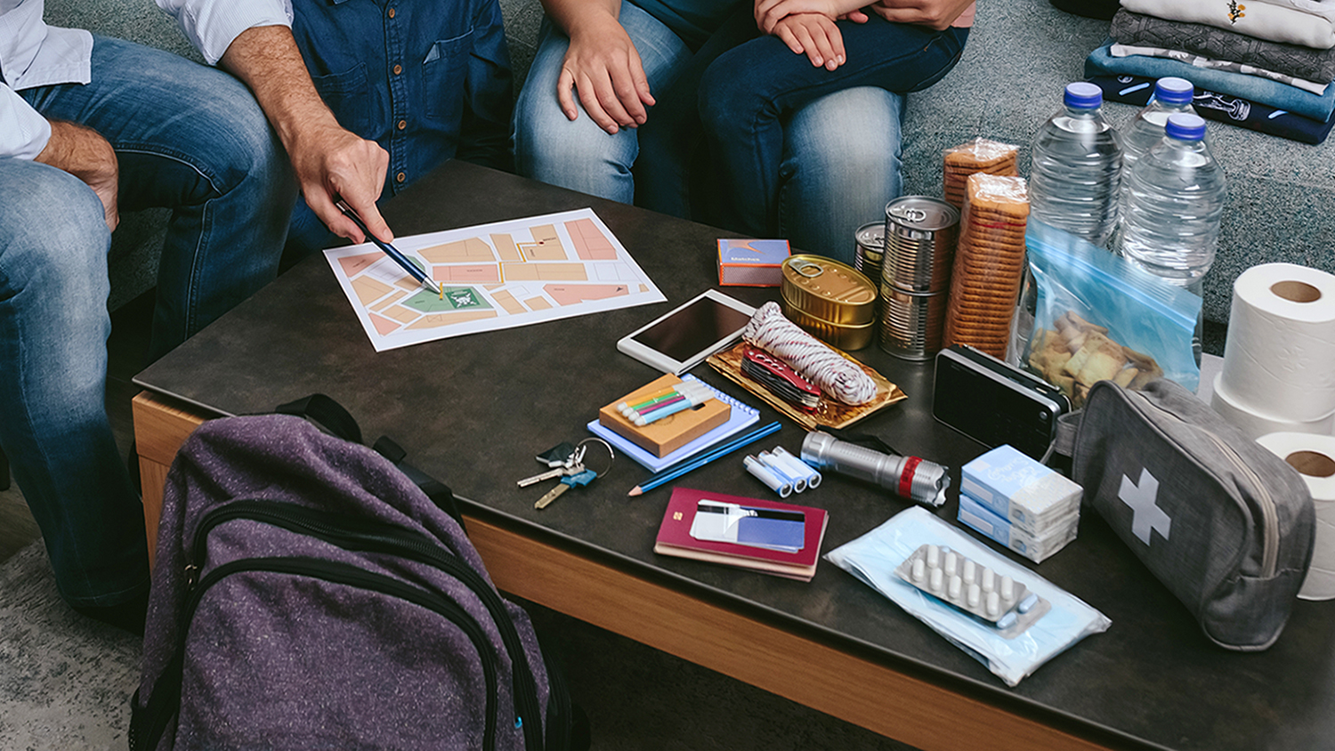 family preparing emergency backpack